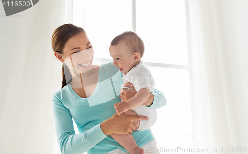 Image of happy young mother with little baby at home