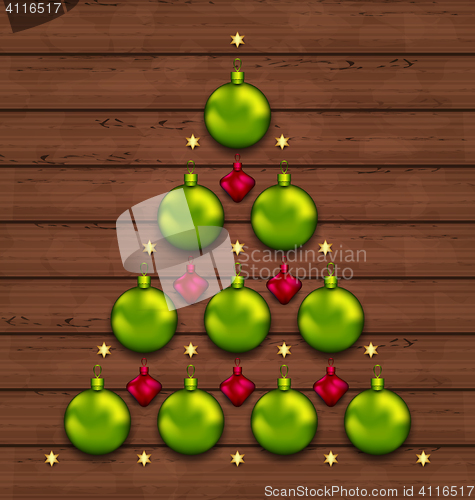 Image of Christmas tree made of baubles on wooden background