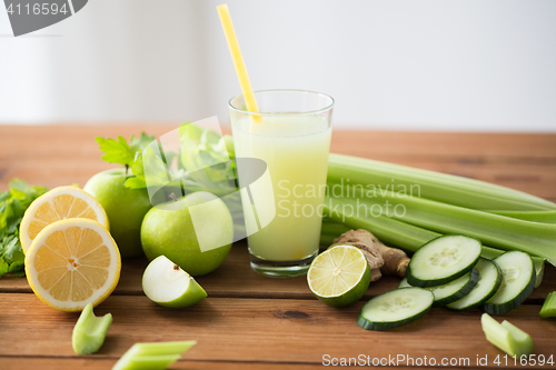 Image of glass of green juice with fruits and vegetables