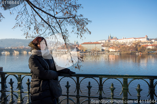 Image of Beautiful Woman in Prague embankment on river Vltava