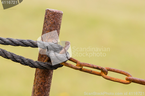 Image of Old chain with rust, steel chain link fence