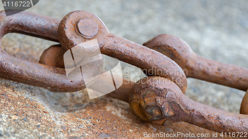 Image of Old chain with rust, steel chain link fence