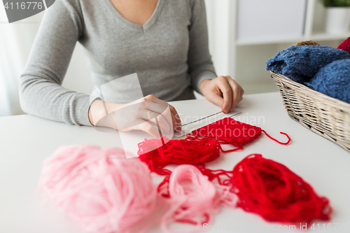 Image of woman hands with knitting needles and yarn