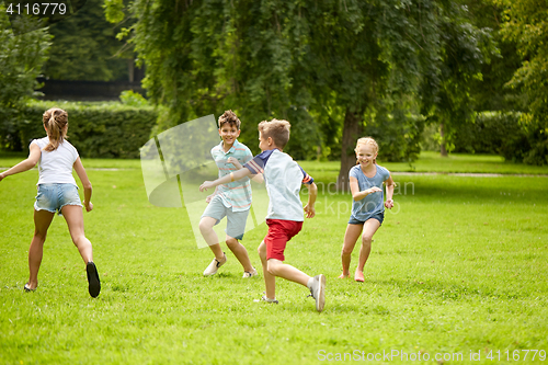 Image of happy kids running and playing game outdoors