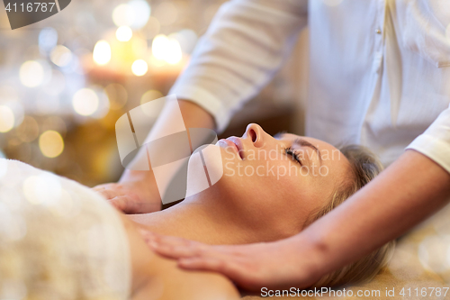 Image of close up of woman lying and having massage in spa