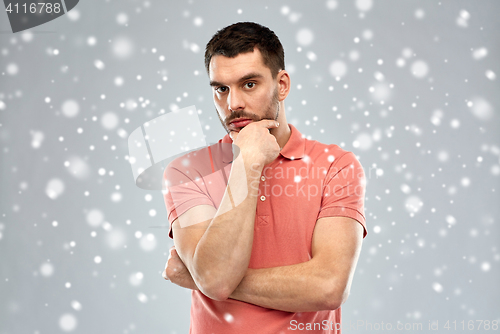 Image of man thinking over snow background