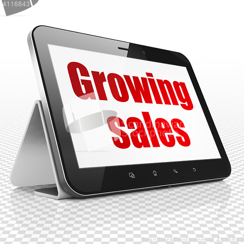 Image of Business concept: Tablet Computer with Growing Sales on display