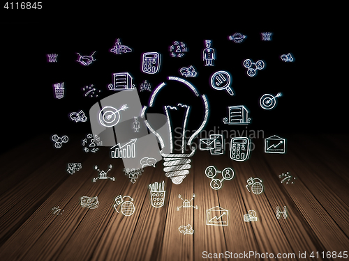 Image of Finance concept: Light Bulb in grunge dark room