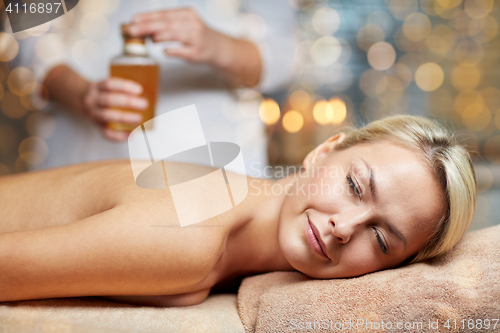 Image of close up of woman lying on massage table in spa