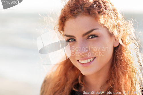 Image of close up of happy young redhead woman face