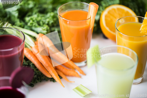 Image of glasses with different fruit or vegetable juices