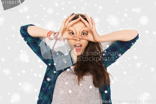 Image of happy teenage girl making face and having fun