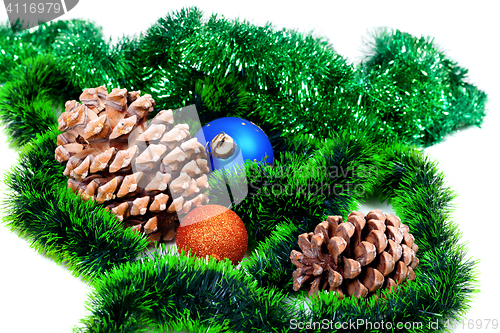 Image of Green Christmas tinsel, Christmas-tree balls and pine cones 