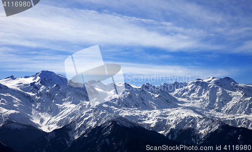 Image of Sunlight snow mountain in wind winter evening
