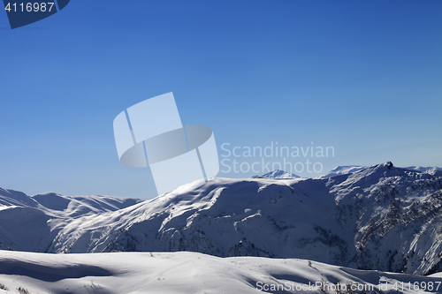 Image of Off-piste slope and blue clear sky in sun morning