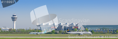 Image of Munich international airport with passenger terminal and traffic