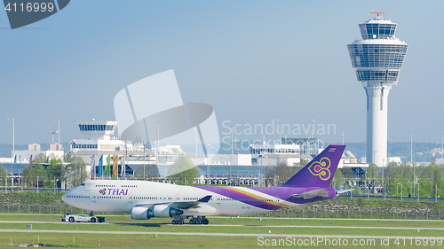 Image of Jet airliner Thai Airways International airlines taxiing on push