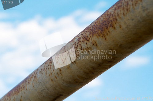 Image of Rusty Bar Against Blue Sky