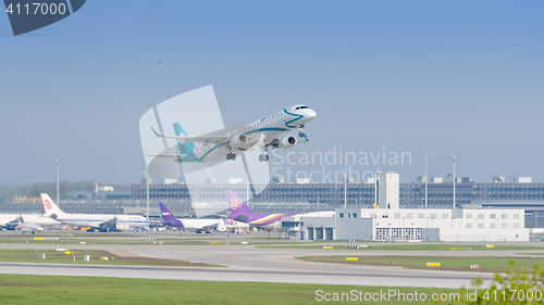 Image of Plane Embraer E-Jet of Air Dolomiti airlines gaining altitude