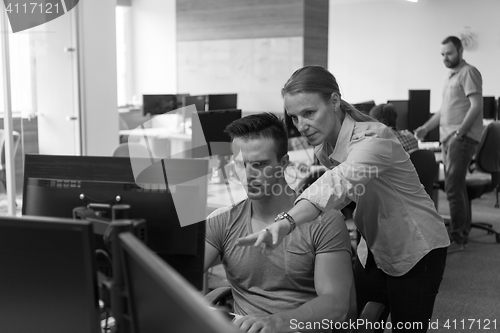 Image of business couple at office
