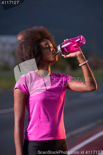 Image of Portrait of a young african american woman running outdoors