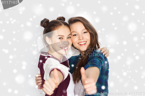 Image of happy smiling teenage girls showing thumbs up