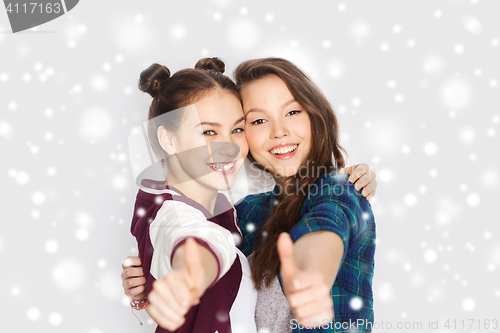Image of happy smiling teenage girls showing thumbs up
