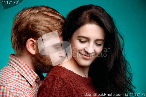 Image of Young man and woman kissing