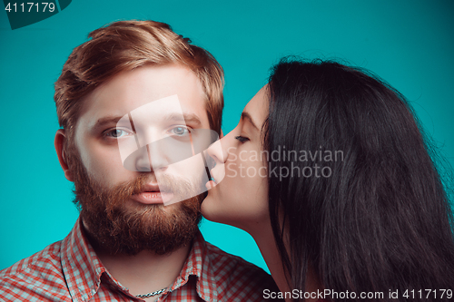 Image of Young man and woman kissing