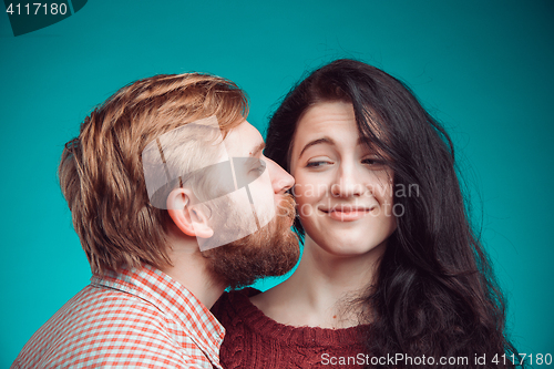 Image of Young man and woman kissing