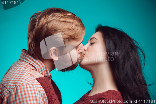 Image of Young man and woman kissing