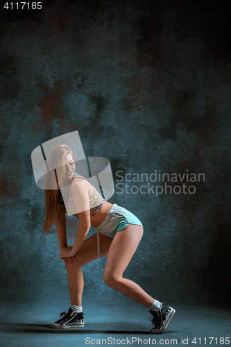 Image of Attractive girl dancing twerk in the studio