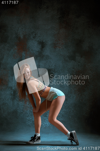 Image of Attractive girl dancing twerk in the studio