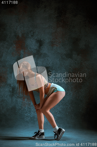 Image of Attractive girl dancing twerk in the studio