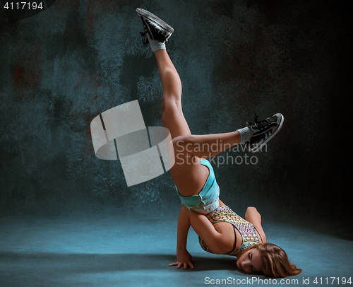 Image of Attractive girl dancing twerk in the studio