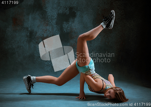 Image of Attractive girl dancing twerk in the studio