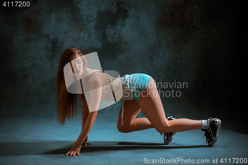 Image of Attractive girl dancing twerk in the studio