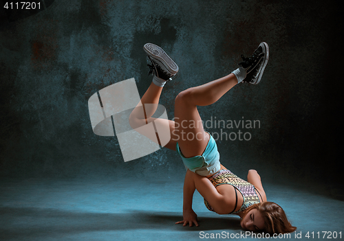 Image of Attractive girl dancing twerk in the studio