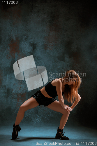 Image of Attractive girl dancing twerk in the studio