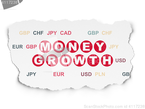 Image of Currency concept: Money Growth on Torn Paper background