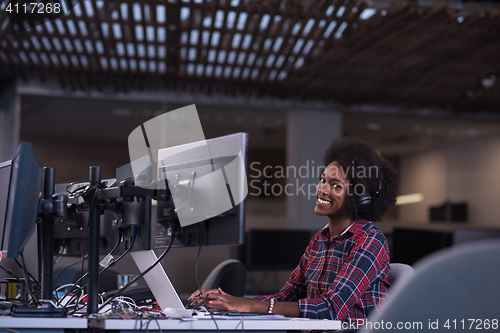 Image of young black woman at her workplace in modern office  African-Ame