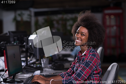 Image of portrait of a young African American woman in modern office