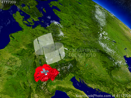 Image of Switzerland with embedded flag on Earth