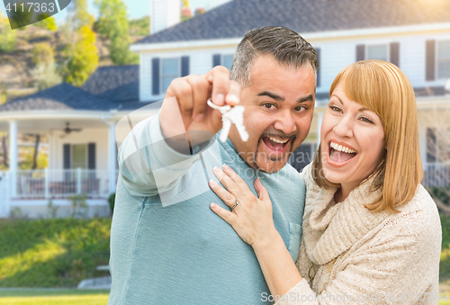 Image of Happy Mixed Race Couple in Front of House with New Keys