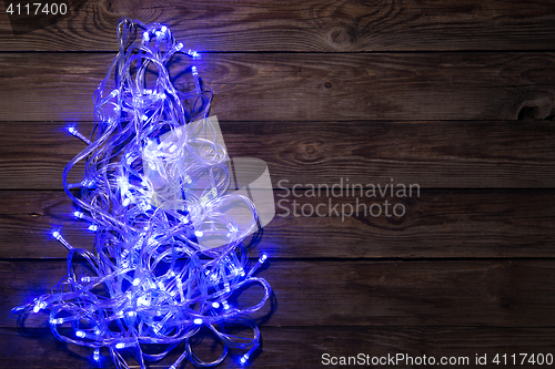 Image of Christmas festoon shining blue color