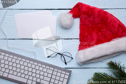 Image of Santa hat, keyboard, spruce branch