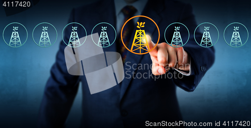 Image of Manager Highlighting An Oil Rig In A Lineup