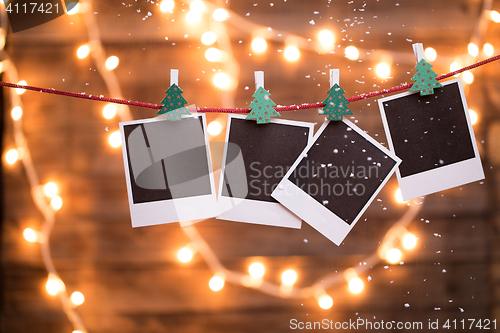 Image of Empty instant photos with garland