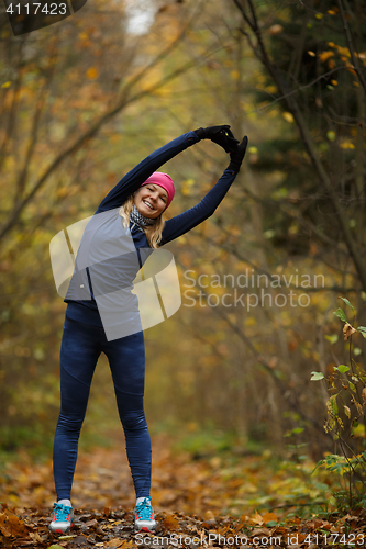 Image of Woman at gym in forest