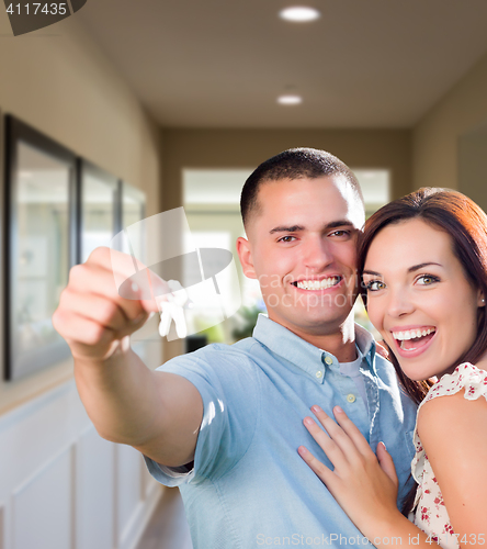 Image of Military Couple with House Keys Inside Hallway